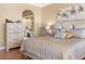 Serene bedroom featuring a decorative headboard, soft lighting, and an ensuite bathroom at 4626 Harbour Village Blvd # 3302, Ponce Inlet, FL 32127