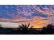 Picturesque sunset view featuring vibrant colors and silhouette of palm trees at 4626 Harbour Village Blvd # 3302, Ponce Inlet, FL 32127