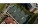 Aerial view of the tennis courts with the condominium complex in the background at 4626 Harbour Village Blvd # 3302, Ponce Inlet, FL 32127
