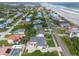 Aerial view showcases neighborhood near the beach with a mix of home styles and lush landscaping at 4734 S Atlantic Ave, Ponce Inlet, FL 32127