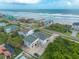 Aerial view of a home near the beach with ocean views and lush surroundings at 4734 S Atlantic Ave, Ponce Inlet, FL 32127