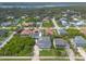 Aerial view of a neighborhood featuring lush landscaping, a mix of home styles, and nearby waterways at 4734 S Atlantic Ave, Ponce Inlet, FL 32127