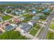 Neighborhood aerial view showcasing a quiet residential street with well-maintained homes and lawns at 4734 S Atlantic Ave, Ponce Inlet, FL 32127