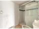 Bathroom featuring tiled shower with glass doors, toilet and towel ring at 4734 S Atlantic Ave, Ponce Inlet, FL 32127