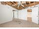 Bedroom with tile flooring, ceiling fan, closet, and partially removed drywall at 4734 S Atlantic Ave, Ponce Inlet, FL 32127