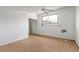 Bedroom featuring hardwood floors, ceiling fan, and natural light at 4734 S Atlantic Ave, Ponce Inlet, FL 32127