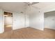 Bedroom featuring hardwood floors, ceiling fan, and closet at 4734 S Atlantic Ave, Ponce Inlet, FL 32127