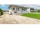 Two-story home featuring a spacious driveway and a lush green yard at 4734 S Atlantic Ave, Ponce Inlet, FL 32127