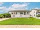 Two-story home featuring a spacious lawn with lush green grass at 4734 S Atlantic Ave, Ponce Inlet, FL 32127