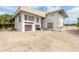 Two-car garage, featuring a spacious driveway and a lush green yard at 4734 S Atlantic Ave, Ponce Inlet, FL 32127