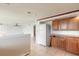 View of the kitchen area connected to the living space, with a white refrigerator at 4734 S Atlantic Ave, Ponce Inlet, FL 32127
