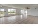Bright living room with tiled floors, and large windows offering outdoor views at 4734 S Atlantic Ave, Ponce Inlet, FL 32127