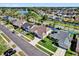 Beautiful home with manicured lawn and pool, located in a serene neighborhood with mature trees and a nearby lake at 510 Silvergate Loop, Lake Mary, FL 32746