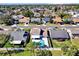 Aerial view of a well-maintained home with a private backyard featuring a pool, surrounded by lush landscaping at 510 Silvergate Loop, Lake Mary, FL 32746