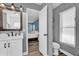 Bathroom featuring a single sink vanity with updated shower and neutral colors at 510 Silvergate Loop, Lake Mary, FL 32746