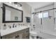 Modern bathroom featuring a vanity with drawers, a framed mirror, a shower with glass, and contemporary fixtures at 510 Silvergate Loop, Lake Mary, FL 32746