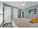 Calm bedroom with hardwood floors, ceiling fan, and an adjacent closet, providing a simple and inviting room at 510 Silvergate Loop, Lake Mary, FL 32746