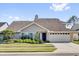 Charming single-story home with a well-manicured lawn, beautiful landscaping, and a two-car garage at 510 Silvergate Loop, Lake Mary, FL 32746