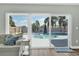 Bright living room featuring sliding glass doors with a view of the private pool area and backyard at 510 Silvergate Loop, Lake Mary, FL 32746