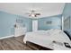 Bright and airy main bedroom with a ceiling fan and luxury vinyl plank flooring at 510 Silvergate Loop, Lake Mary, FL 32746