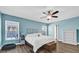 Well-lit main bedroom with a ceiling fan, ensuite, and outdoor access to a pool at 510 Silvergate Loop, Lake Mary, FL 32746