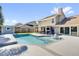 Gorgeous backyard oasis featuring a sparkling pool, covered patio, and plenty of space for entertaining at 510 Silvergate Loop, Lake Mary, FL 32746