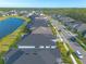 An aerial view of a residential neighborhood highlighting the street layout and a nearby lake at 6271 W Fallsgrove Ln, Port Orange, FL 32128