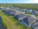 Community aerial view showcasing the neighborhood's layout and backyard with screened-in patio at 6271 W Fallsgrove Ln, Port Orange, FL 32128