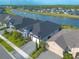 A high-angle aerial view of the house and surrounding homes, showing the community at 6271 W Fallsgrove Ln, Port Orange, FL 32128