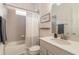 This bathroom features a shower-tub combo, and modern vanity at 6271 W Fallsgrove Ln, Port Orange, FL 32128