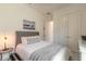 Well-lit bedroom with neutral tones, closet, and comfortable bed at 6271 W Fallsgrove Ln, Port Orange, FL 32128