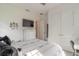 This bedroom features lots of natural light, neutral decor, and a wall-mounted television at 6271 W Fallsgrove Ln, Port Orange, FL 32128