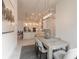 Open-concept dining area with modern lighting and seamless flow to the kitchen at 6271 W Fallsgrove Ln, Port Orange, FL 32128