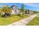 Attractive single Gathering home with a green lawn and tropical landscaping at 6271 W Fallsgrove Ln, Port Orange, FL 32128