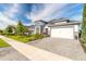Elegant single Gathering home with brick paved driveway and well maintained lawn at 6271 W Fallsgrove Ln, Port Orange, FL 32128