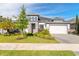 Beautiful single Gathering home with manicured lawn and a two car garage at 6271 W Fallsgrove Ln, Port Orange, FL 32128