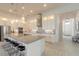 Bright and open kitchen with a large granite island and stainless steel appliances at 6271 W Fallsgrove Ln, Port Orange, FL 32128