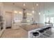 Bright kitchen features granite countertops, stainless steel appliances, and pendant lighting above the island at 6271 W Fallsgrove Ln, Port Orange, FL 32128