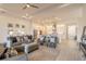Open-concept living space showcasing the kitchen, dining area, and comfortable seating at 6271 W Fallsgrove Ln, Port Orange, FL 32128