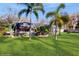 Expansive backyard featuring a sparkling pool and tropical landscaping at 7108 East Rd, Lakeland, FL 33809