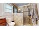 Bathroom with tiled shower and toilet at 7108 East Rd, Lakeland, FL 33809