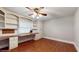 Spacious bedroom featuring a built-in desk and shelving for organization and decor at 7108 East Rd, Lakeland, FL 33809
