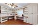 Bright bedroom with custom built-ins, providing ample storage and workspace at 7108 East Rd, Lakeland, FL 33809