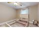 Neutral bedroom features decorative ceiling fan and empty bed frame on wood-look flooring at 7108 East Rd, Lakeland, FL 33809