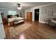 Cozy primary bedroom with wood floors, fan, and warm decor at 7108 East Rd, Lakeland, FL 33809