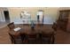 Dining room featuring wood floors, wooden furniture and views into other rooms at 7108 East Rd, Lakeland, FL 33809