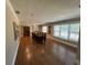 Bright and spacious dining room with hardwood floors, abundant natural light, and classic furnishings at 7108 East Rd, Lakeland, FL 33809