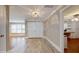 Inviting foyer with wood floors, double doors, and views into other living spaces at 7108 East Rd, Lakeland, FL 33809