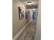 Hallway features neutral paint and wood-look flooring at 7108 East Rd, Lakeland, FL 33809