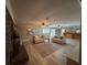Spacious living area featuring a brick fireplace, a wet bar, and comfortable seating at 7108 East Rd, Lakeland, FL 33809